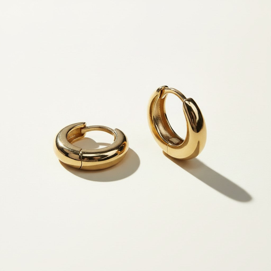 chunky gold huggie hoops, gold dome hoop earrings, thick gold huggie earrings, small gold hoop earrings, hinged hoop earrings, snap closure hoops, polished gold hoops, everyday gold earrings, minimalist hoop earrings, classic gold huggies, lightweight chunky hoops, gift for her