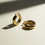 mini dome hoop earrings flat lay, small gold hoops detail, chunky mini hoops, rounded gold earrings, everyday small hoops, polished dome earrings, compact gold hoops, thick gold hoop earrings