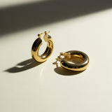 mini dome hoop earrings flat lay, small gold hoops detail, chunky mini hoops, rounded gold earrings, everyday small hoops, polished dome earrings, compact gold hoops, thick gold hoop earrings