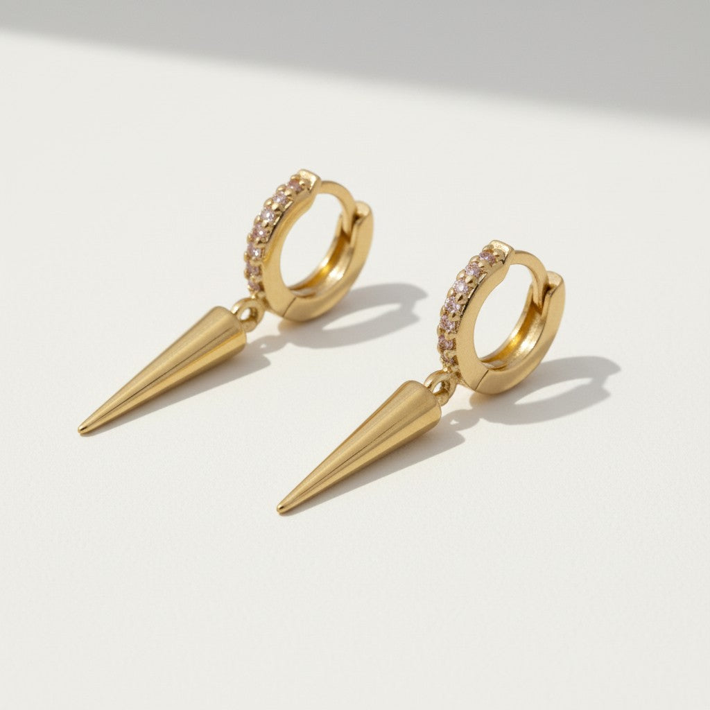 spike drop huggie earrings, pave huggie hoops, gold spike earrings, pink pave earrings, huggie earrings with charm, minimalist spike jewelry, 18K gold overlay earrings, drop earrings flat lay