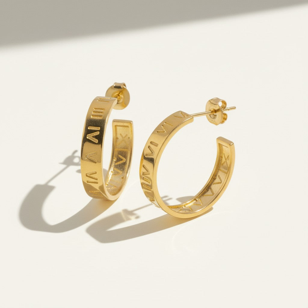 roman numeral hoop earrings, engraved gold hoop earrings, gold hoop earrings flat lay, numeral motif earrings, small gold hoops, post back hoop earrings, everyday gold jewelry, minimalist statement earrings