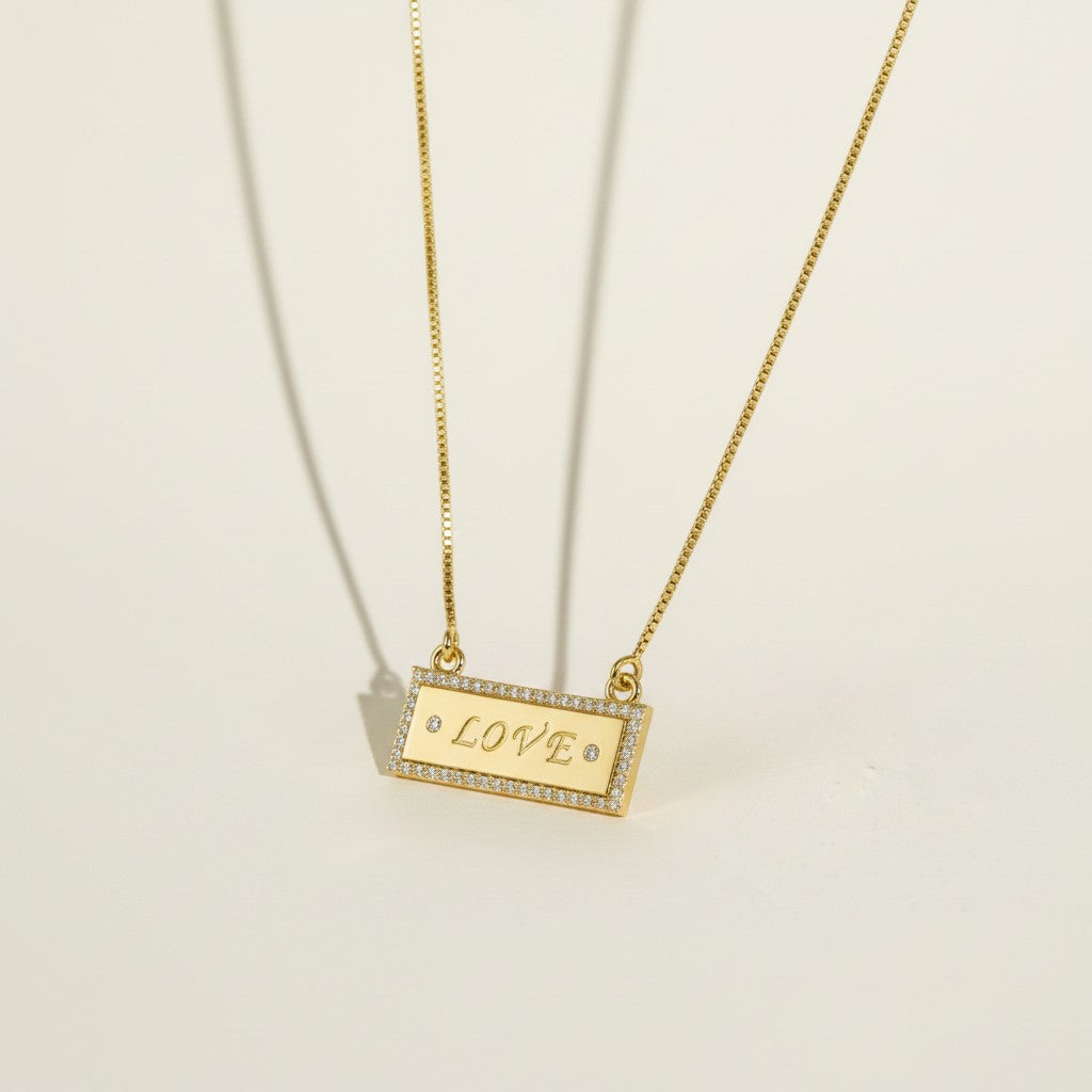 gold LOVE necklace, LOVE bar necklace, engraved bar pendant necklace, gold nameplate necklace, cubic zirconia pavé pendant, box chain necklace, heart extender chain necklace, adjustable gold necklace, word necklace, anniversary gift necklace, Valentine's Day jewelry, gift for her, romantic gold jewelry, dainty gold pendant