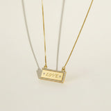 gold LOVE necklace, LOVE bar necklace, engraved bar pendant necklace, gold nameplate necklace, cubic zirconia pavé pendant, box chain necklace, heart extender chain necklace, adjustable gold necklace, word necklace, anniversary gift necklace, Valentine's Day jewelry, gift for her, romantic gold jewelry, dainty gold pendant