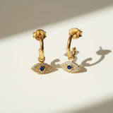 evil eye hoop earrings, gold evil eye charm earrings, 18k gold overlay hoops, pave cubic zirconia earrings, Donna Italiana jewelry, hypoallergenic gold earrings, waterproof gold jewelry, small gold hoop earrings, dainty charm hoops