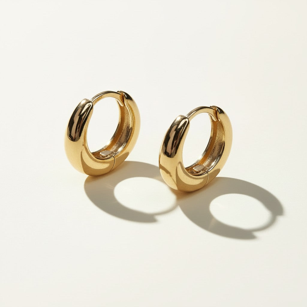 chunky gold huggie hoops, gold dome hoop earrings, thick gold huggie earrings, small gold hoop earrings, hinged hoop earrings, snap closure hoops, polished gold hoops, everyday gold earrings, minimalist hoop earrings, classic gold huggies, lightweight chunky hoops, gift for her