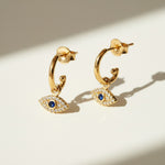 evil eye hoop earrings, gold evil eye charm earrings, 18k gold overlay hoops, pave cubic zirconia earrings, Donna Italiana jewelry, hypoallergenic gold earrings, waterproof gold jewelry, small gold hoop earrings, dainty charm hoops