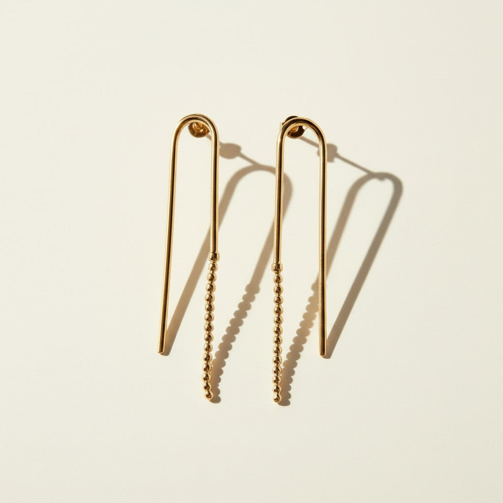 arch drop earrings, beaded wire earrings, gold U-shaped earrings, minimalist drop earrings, linear gold earrings, long wire earrings, geometric drop earrings, stud post drop earrings