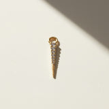 bold CZ spear earring charm — a tapered gold spike lined with a graduated row of sparkling cubic zirconia stones that narrows to a fine, polished point. Crafted in 18k gold overlay, this 20mm charm is designed to attach easily via its jump ring to our 9mm or 11mm seamless hoops (sold separately), letting you customize your hoops with a touch of shimmer and edge.