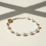 baroque pearl bracelet flat lay, freshwater pearl bracelet, gold chain pearl bracelet, adjustable pearl bracelet clasp, handcrafted baroque pearl jewelry, pearl and gold chain bracelet, statement clasp pearl bracelet, organic pearl bracelet detail