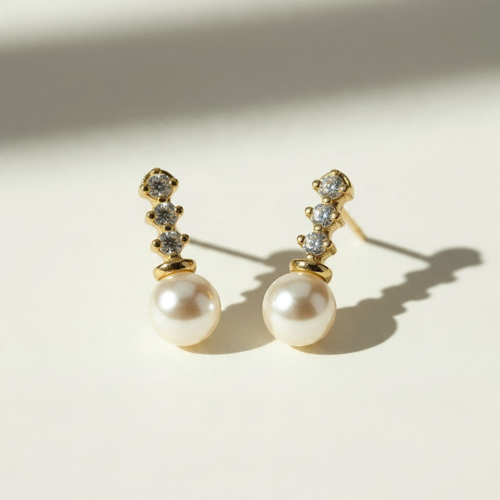 pearl drop earrings, gold pearl and crystal earrings, bridal pearl earrings, pearl stud drop earrings, dainty pearl earrings, classic pearl earrings, cubic zirconia pearl earrings, wedding earrings, elegant pearl earrings, matching necklace and earring set, gift pearl earrings, women’s pearl drop earrings