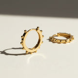 beaded hoop earrings, studded gold hoops, 18K gold overlay hoop earrings, textured hoop earrings, statement hoop earrings, small gold hoops, bead detail earrings, hoop earrings flat lay