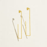 gold rectangle earrings, long geometric earrings, minimalist gold wire earrings, open rectangle hoop earrings, modern gold drop earrings, lightweight statement earrings, architectural earrings, thin gold wire earrings, elongated hoop earrings, contemporary gold jewelry, linear gold earrings, women’s geometric earrings
