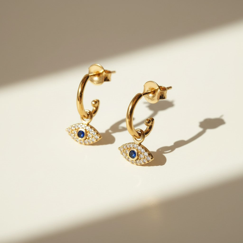 evil eye hoop earrings, gold evil eye charm earrings, 18k gold overlay hoops, pave cubic zirconia earrings, Donna Italiana jewelry, hypoallergenic gold earrings, waterproof gold jewelry, small gold hoop earrings, dainty charm hoops