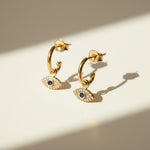 evil eye hoop earrings, gold evil eye charm earrings, 18k gold overlay hoops, pave cubic zirconia earrings, Donna Italiana jewelry, hypoallergenic gold earrings, waterproof gold jewelry, small gold hoop earrings, dainty charm hoops