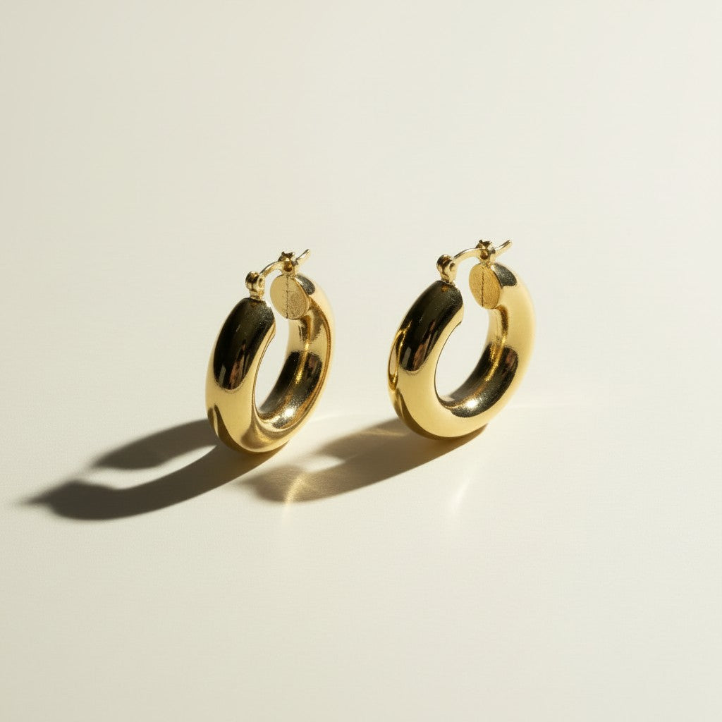 mini dome hoop earrings flat lay, small gold hoops detail, chunky mini hoops, rounded gold earrings, everyday small hoops, polished dome earrings, compact gold hoops, thick gold hoop earrings