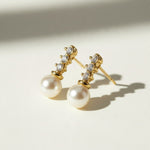 pearl drop earrings, gold pearl and crystal earrings, bridal pearl earrings, pearl stud drop earrings, dainty pearl earrings, classic pearl earrings, cubic zirconia pearl earrings, wedding earrings, elegant pearl earrings, matching necklace and earring set, gift pearl earrings, women’s pearl drop earrings