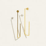 gold rectangle earrings, long geometric earrings, minimalist gold wire earrings, open rectangle hoop earrings, modern gold drop earrings, lightweight statement earrings, architectural earrings, thin gold wire earrings, elongated hoop earrings, contemporary gold jewelry, linear gold earrings, women’s geometric earrings