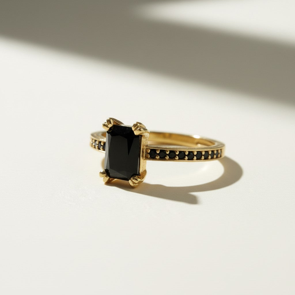 black stone cocktail ring, emerald cut ring gold, black onyx ring, vintage style statement ring, art deco cocktail ring, pavé black stone ring, gold statement ring on-model, dark gemstone ring