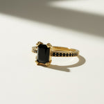 black stone cocktail ring, emerald cut ring gold, black onyx ring, vintage style statement ring, art deco cocktail ring, pavé black stone ring, gold statement ring on-model, dark gemstone ring