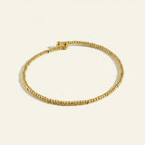 gold beaded stretch bracelet, gold bead bracelet, stretch bracelet gold, minimalist beaded bracelet, stackable gold bracelet, dainty gold bead bracelet, no clasp bracelet, layering bracelet flat lay