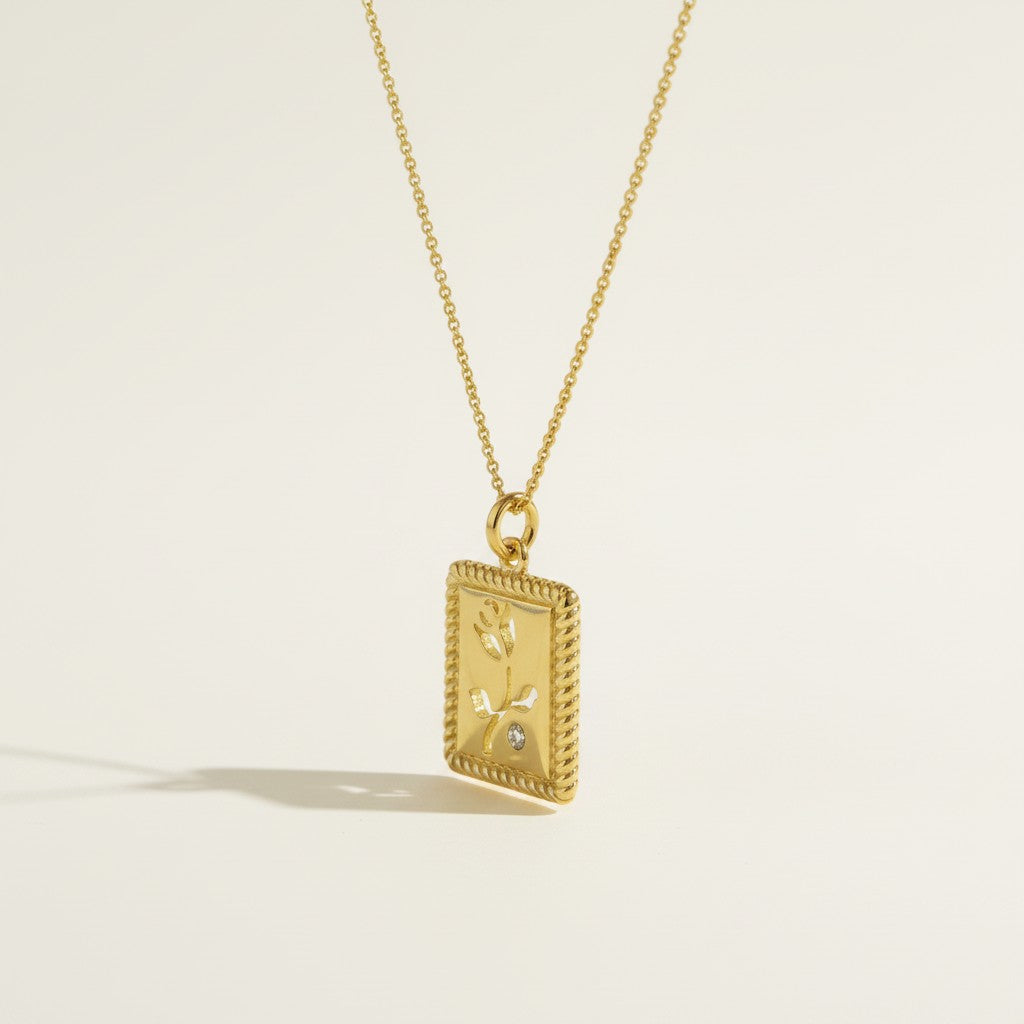 tulip pendant necklace, gold flower tag necklace, botanical pendant necklace, engraved tulip necklace, dainty gold necklace, CZ accent pendant, nature-inspired jewelry, rope-edge tag necklace