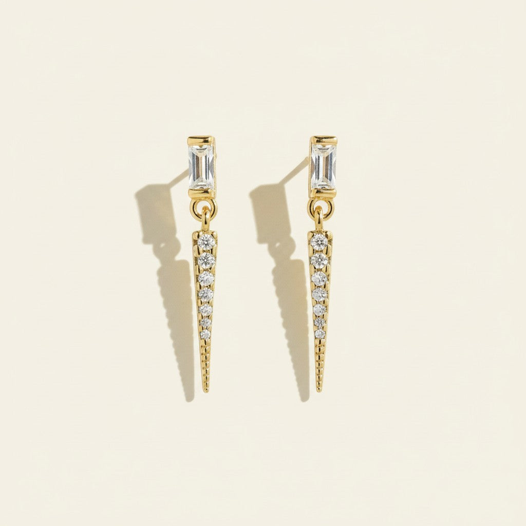 baguette crystal earrings, crystal drop earrings detail, pave spike earrings, gold drop earrings, 18K gold overlay earrings, dainty crystal drop, statement stud earrings, crystal earrings flat lay