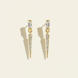baguette crystal earrings, crystal drop earrings detail, pave spike earrings, gold drop earrings, 18K gold overlay earrings, dainty crystal drop, statement stud earrings, crystal earrings flat lay
