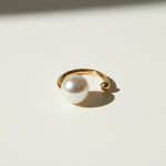 pearl ear cuff, gold ear cuff with pearl, sculptural ear cuff, asymmetric ear cuff, avant-garde pearl jewelry, no-piercing ear cuff, modern pearl earring, artistic gold ear cuff