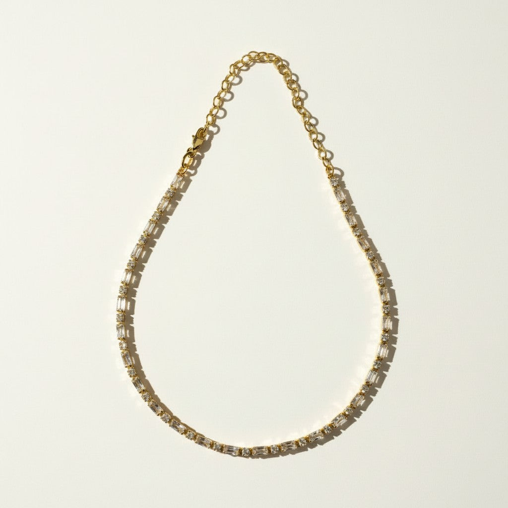 CZ tennis choker flat lay, baguette round cut necklace detail, cubic zirconia choker construction, tennis necklace with extender chain, sparkly choker flat lay, stainless steel CZ necklace, alternating stone tennis necklace, gold tennis choker detail