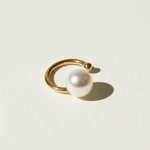 pearl ear cuff, gold ear cuff with pearl, sculptural ear cuff, asymmetric ear cuff, avant-garde pearl jewelry, no-piercing ear cuff, modern pearl earring, artistic gold ear cuff