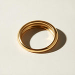 chunky dome ring flat lay, gold dome ring detail, bold gold band ring, teardrop dome ring, 18k gold overlay ring, thick gold ring, statement gold ring, smooth gold band ring