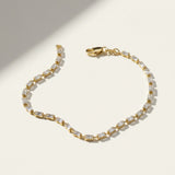 baguette CZ tennis bracelet, all baguette cubic zirconia bracelet, gold baguette bracelet flat lay, art deco tennis bracelet, sparkly baguette bracelet, emerald cut CZ bracelet, tennis bracelet clasp detail, uniform stone tennis bracelet