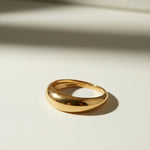 chunky dome ring flat lay, gold dome ring detail, bold gold band ring, teardrop dome ring, 18k gold overlay ring, thick gold ring, statement gold ring, smooth gold band ring
