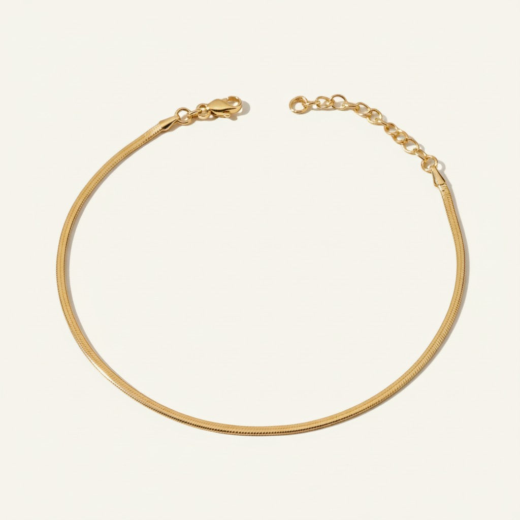 herringbone chain anklet flat lay, gold anklet construction detail, 18k gold overlay anklet, adjustable gold ankle chain, herringbone anklet clasp, matching jewelry set anklet, flat link ankle chain, gold anklet macro detail