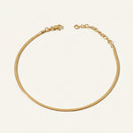 herringbone chain anklet flat lay, gold anklet construction detail, 18k gold overlay anklet, adjustable gold ankle chain, herringbone anklet clasp, matching jewelry set anklet, flat link ankle chain, gold anklet macro detail