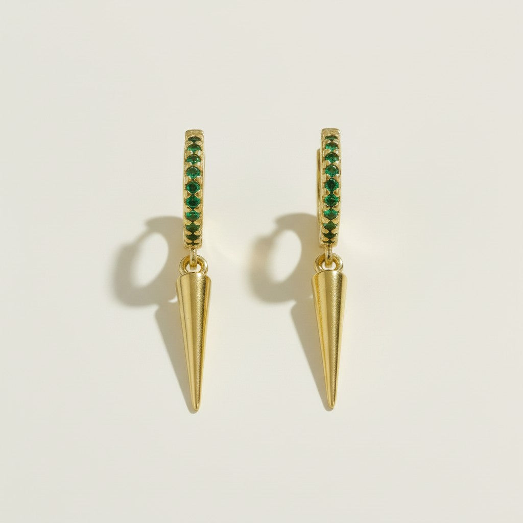 gold huggie hoop emerald spike, emerald pave hoop earrings, green crystal drop huggie earrings, spike charm hoop earrings green, gold and emerald earrings, colorful edgy hoops, huggie earrings with drop