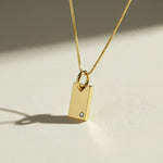 gold tag pendant necklace, rectangle pendant necklace, gold bar pendant necklace, minimalist pendant necklace, box chain necklace, small crystal pendant necklace, dainty gold necklace, gold-tone layering necklace, personalized pendant necklace, engravable pendant necklace, everyday gold necklace, gift for her jewelry