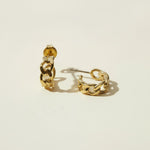 textured chain-link hoop earrings flat lay, gold chain hoop earrings detail, chunky textured hoops, small gold hoops, sculptural gold hoops, statement chain earrings, everyday textured hoops, gold link earrings