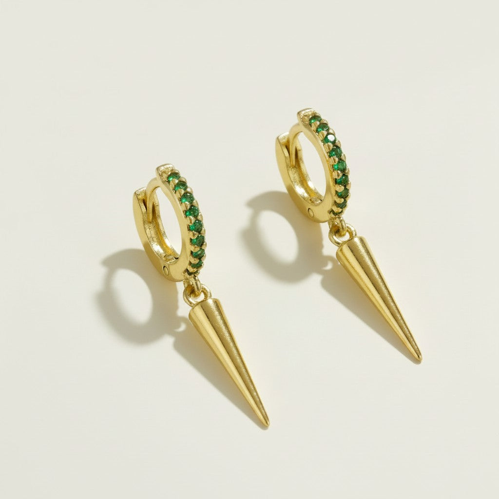 gold huggie hoop emerald spike, emerald pave hoop earrings, green crystal drop huggie earrings, spike charm hoop earrings green, gold and emerald earrings, colorful edgy hoops, huggie earrings with drop