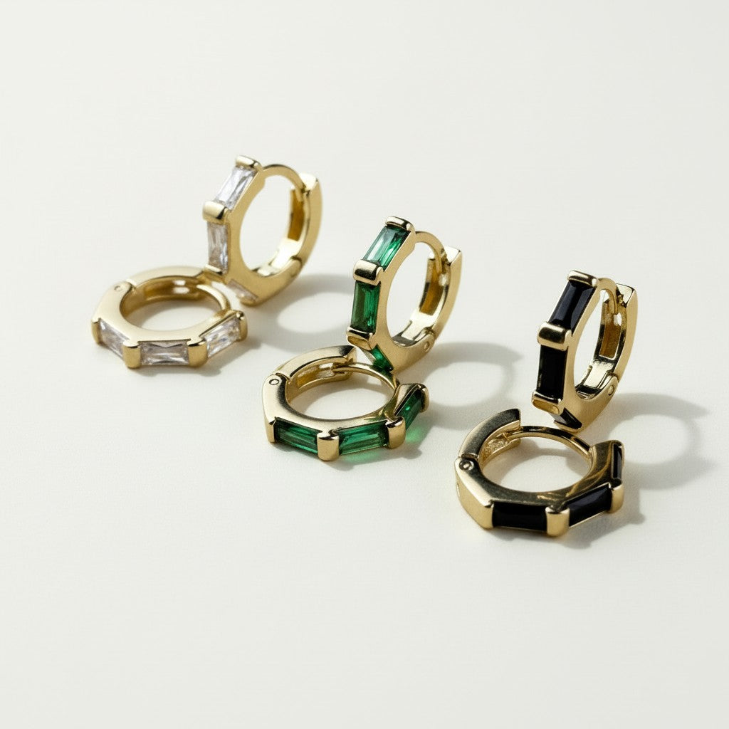 gold baguette hoop earrings, huggie hoops with stones, black baguette earrings, emerald huggie hoops, clear crystal hoop earrings, gold huggie hoops colorways, baguette cut earrings, statement huggie hoops