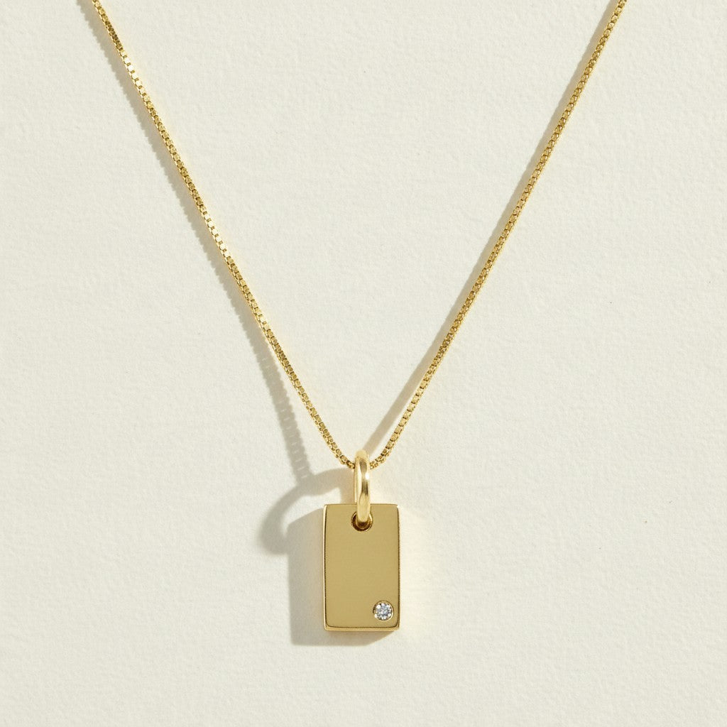 gold tag pendant necklace, rectangle pendant necklace, gold bar pendant necklace, minimalist pendant necklace, box chain necklace, small crystal pendant necklace, dainty gold necklace, gold-tone layering necklace, personalized pendant necklace, engravable pendant necklace, everyday gold necklace, gift for her jewelry