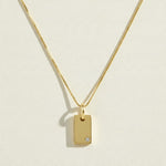 gold tag pendant necklace, rectangle pendant necklace, gold bar pendant necklace, minimalist pendant necklace, box chain necklace, small crystal pendant necklace, dainty gold necklace, gold-tone layering necklace, personalized pendant necklace, engravable pendant necklace, everyday gold necklace, gift for her jewelry
