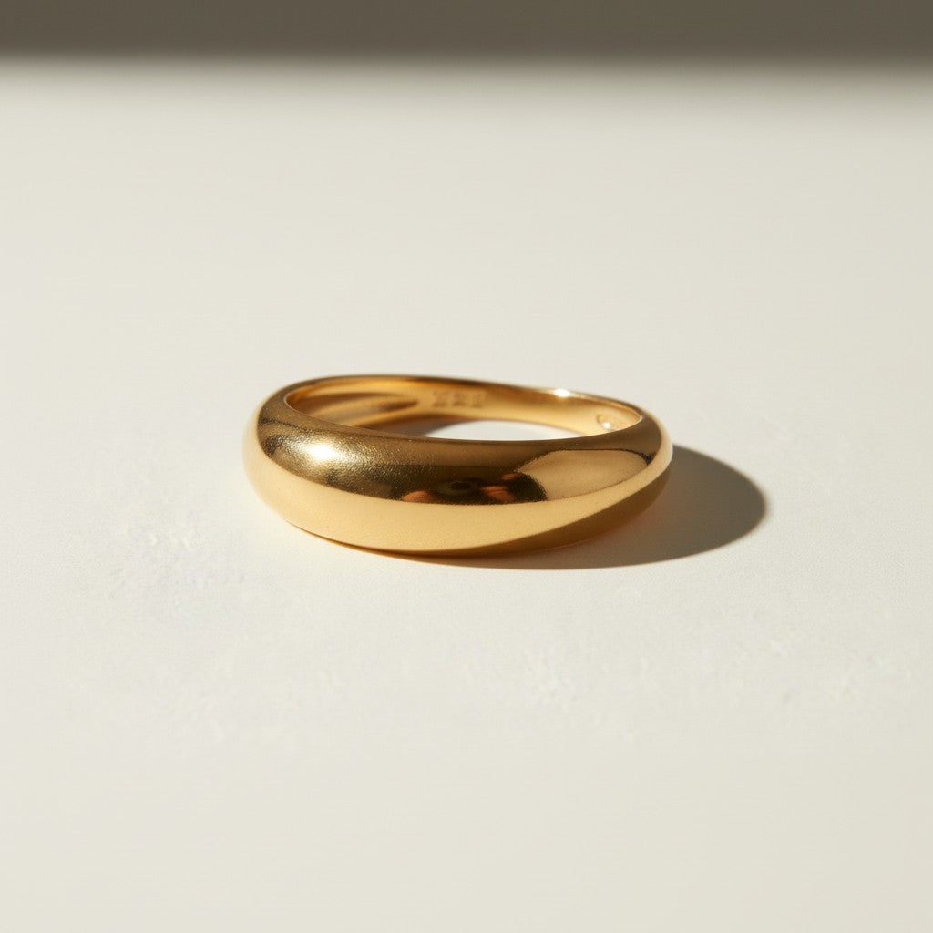 chunky dome ring flat lay, gold dome ring detail, bold gold band ring, teardrop dome ring, 18k gold overlay ring, thick gold ring, statement gold ring, smooth gold band ring