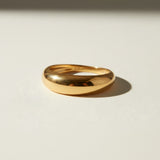 chunky dome ring flat lay, gold dome ring detail, bold gold band ring, teardrop dome ring, 18k gold overlay ring, thick gold ring, statement gold ring, smooth gold band ring