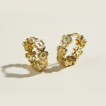 gold flower huggie hoop earrings, daisy hoop earrings, floral huggie earrings, small gold flower hoops, textured flower earrings, dainty floral hoops, garden jewelry, nature-inspired earrings, gold huggie earrings, spring floral jewelry, bridesmaid gift, gift for her