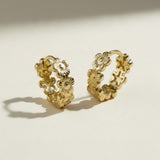 gold flower huggie hoop earrings, daisy hoop earrings, floral huggie earrings, small gold flower hoops, textured flower earrings, dainty floral hoops, garden jewelry, nature-inspired earrings, gold huggie earrings, spring floral jewelry, bridesmaid gift, gift for her