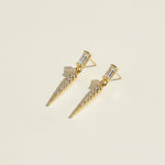 baguette crystal earrings, crystal drop earrings detail, pave spike earrings, gold drop earrings, 18K gold overlay earrings, dainty crystal drop, statement stud earrings, crystal earrings flat lay