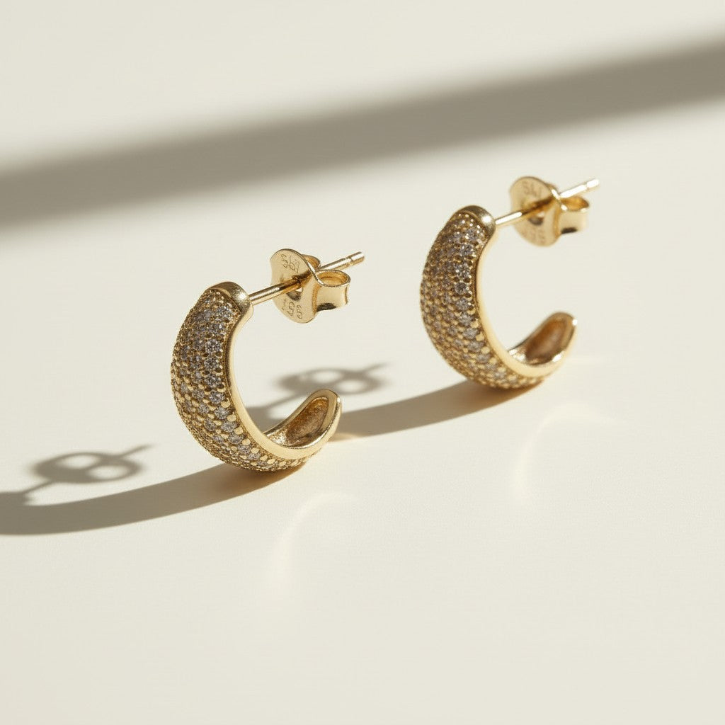 textured gold hoop earrings flat lay, pave dome hoop earrings, sparkly textured hoops detail, micro CZ gold hoops, stardust texture earrings, tapered gold huggie hoops, sugared gold earrings, statement pave hoops