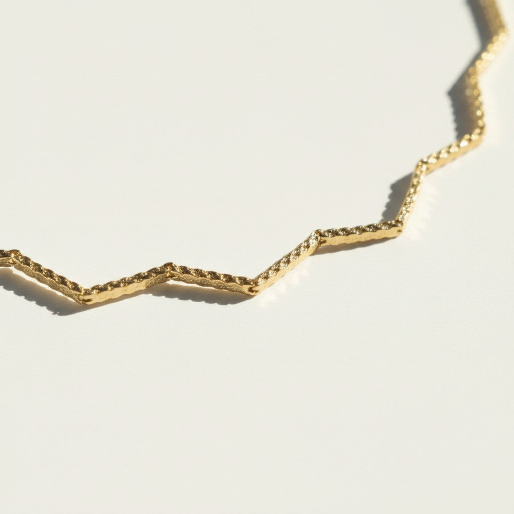 zig zag choker flat lay, geometric gold choker, diamond cut zigzag necklace, textured gold choker, adjustable geometric choker, 18k gold filled choker, chevron chain necklace, gold choker macro detail