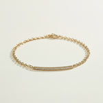 CZ bar bracelet flat lay, cubic zirconia bracelet detail, gold overlay bracelet construction, adjustable CZ bracelet clasp, sparkly bar bracelet, rolo chain CZ bracelet, minimalist gold bracelet, pave CZ bracelet closeup